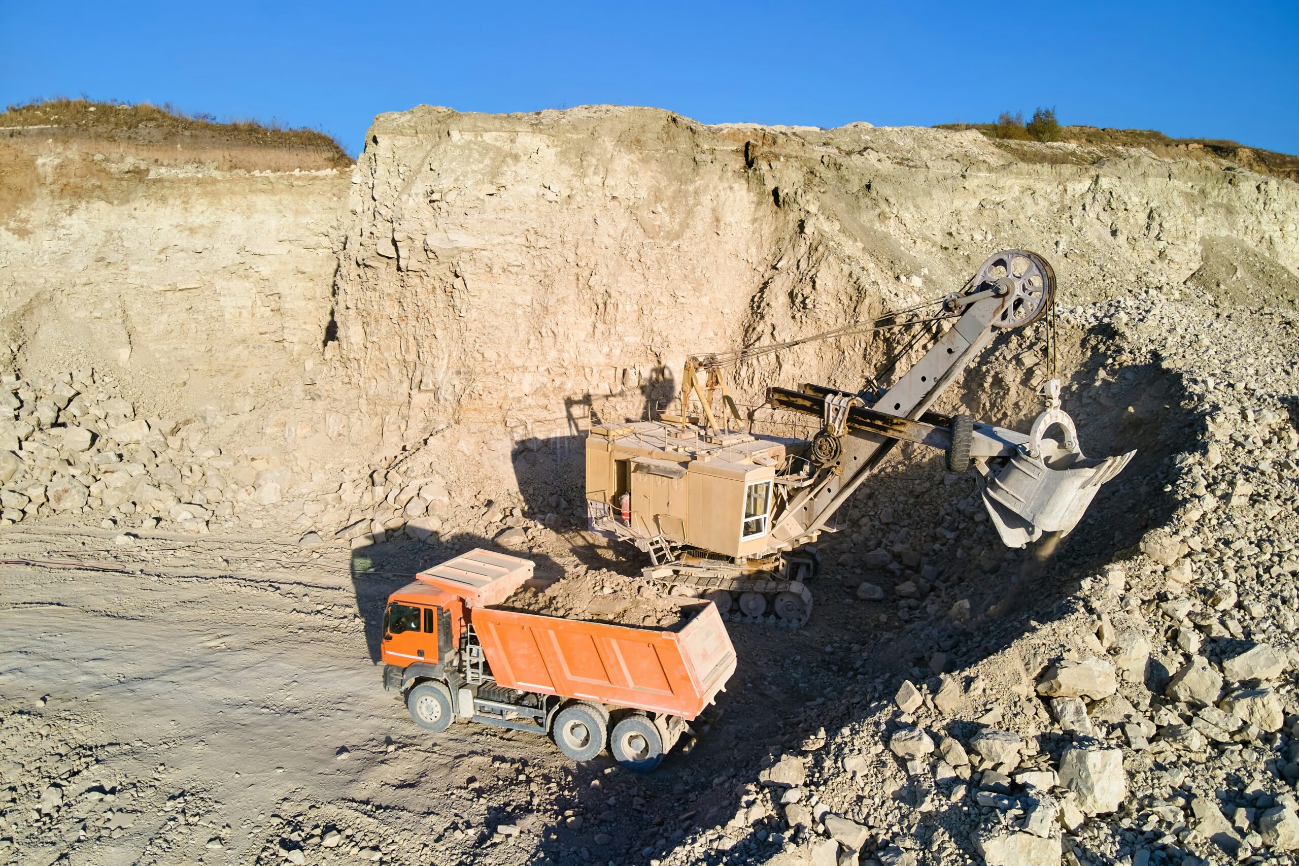 Inspectors supervising stockpile measurement