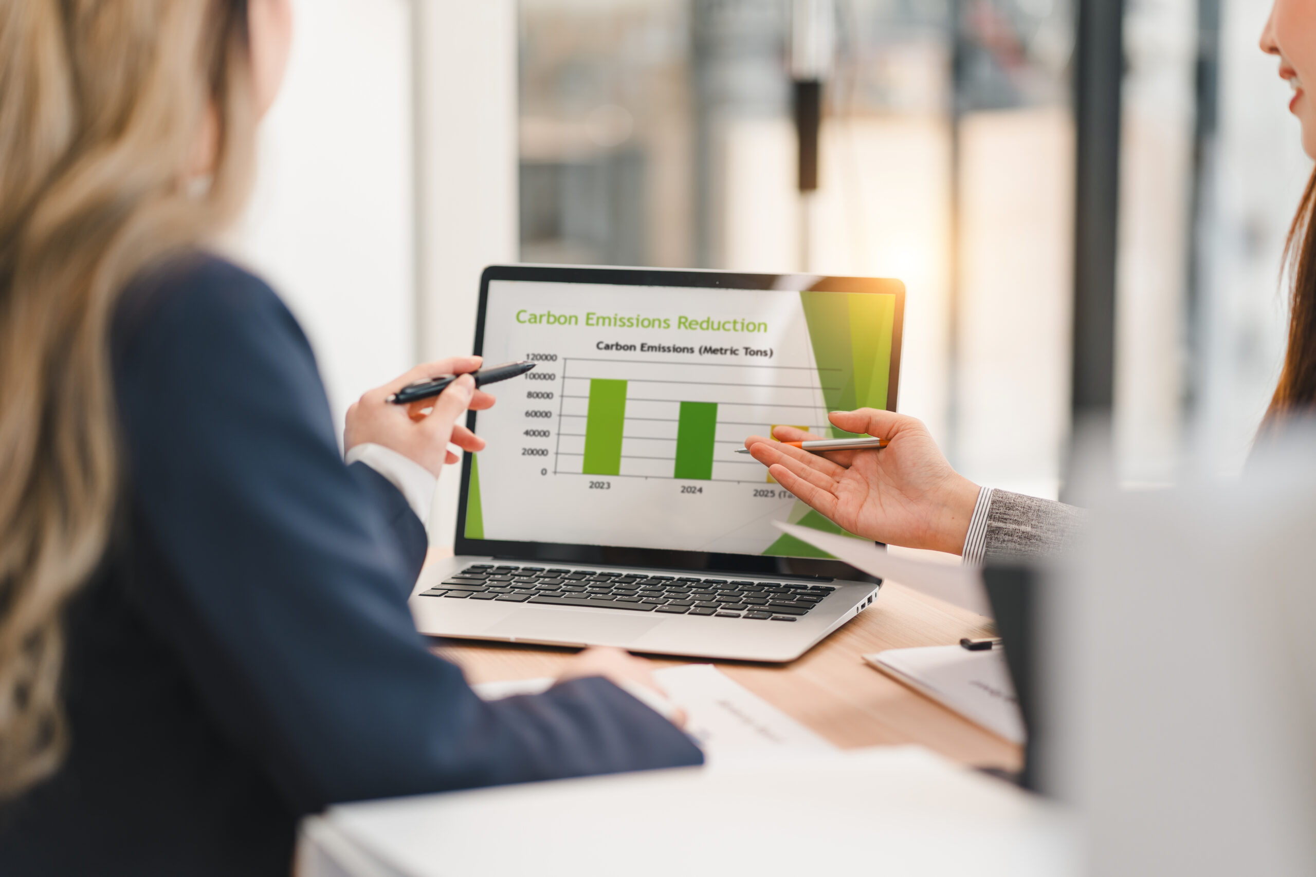 A professional team analyzing data and compliance reports.