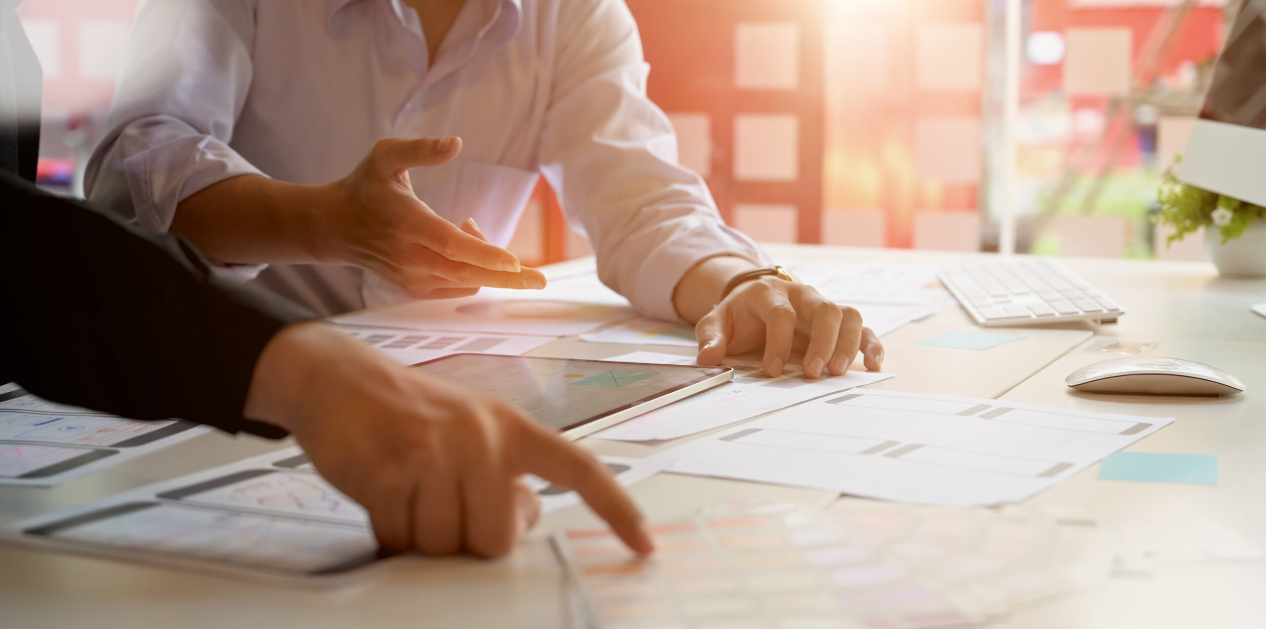 Medical device plans and documents on a desk.